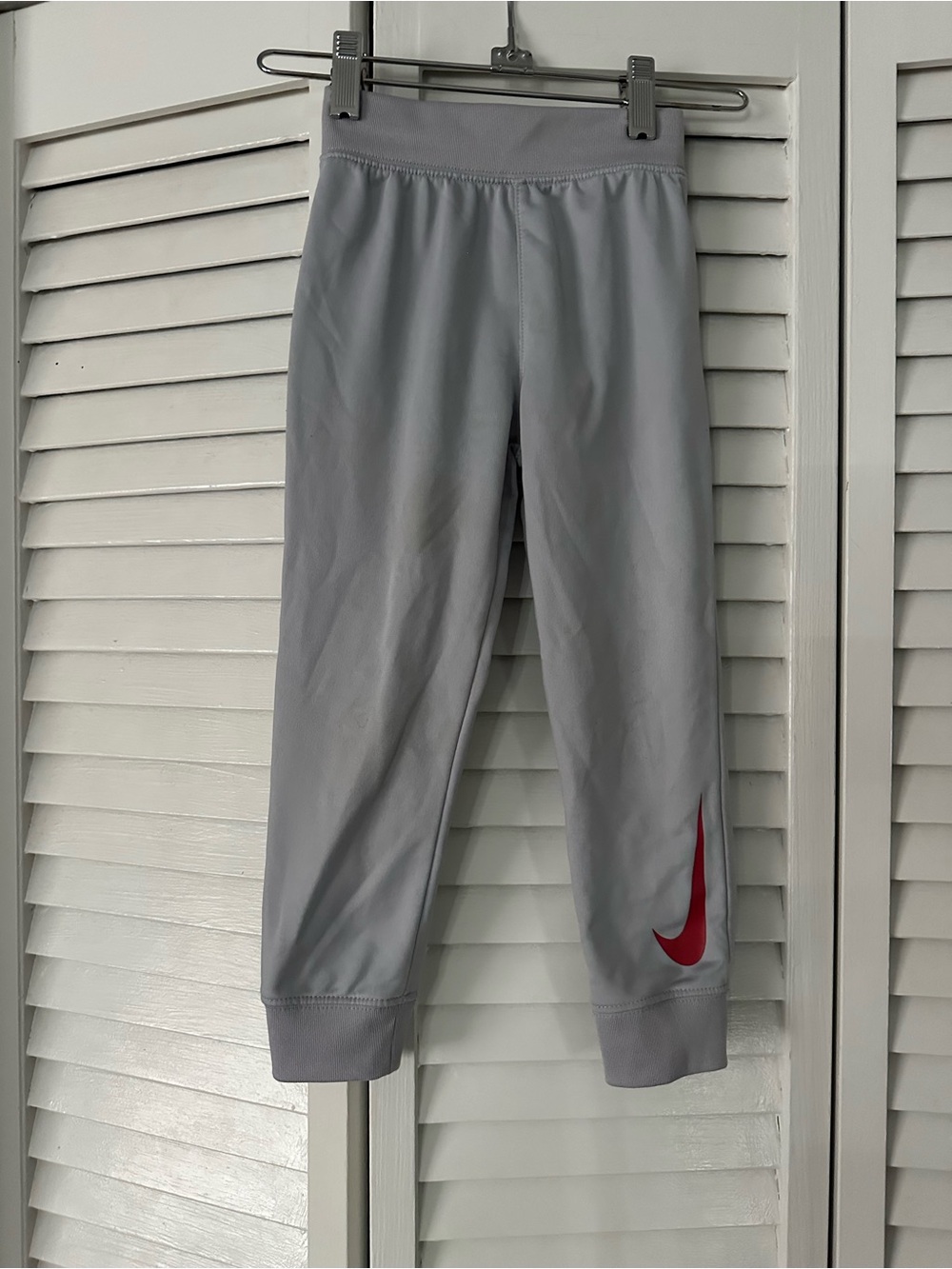 Nike Kids Light Gray Leggings with Red Swoosh